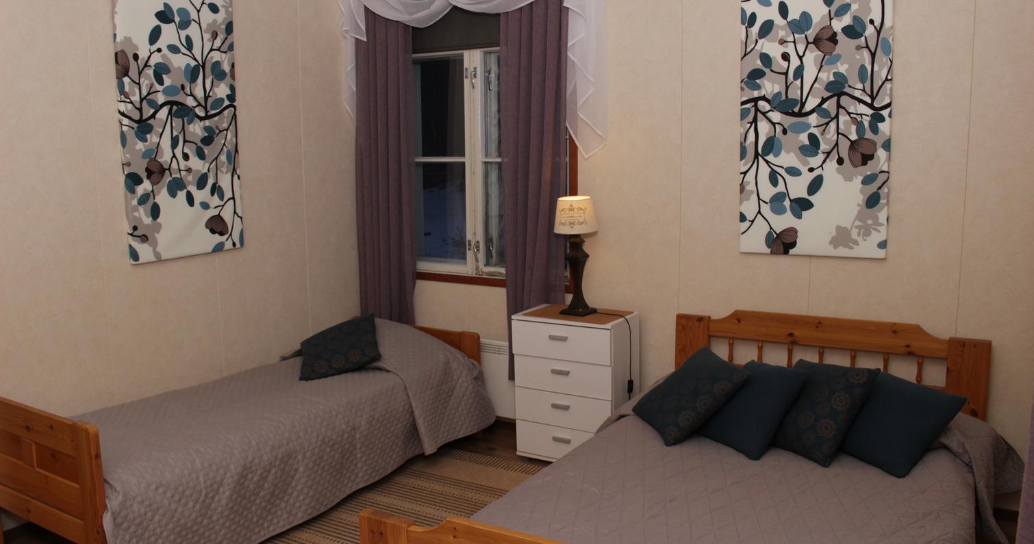 Suma-huoneiston makuuhuone